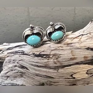 Stamped sterling silver and turquoise post earrings.
